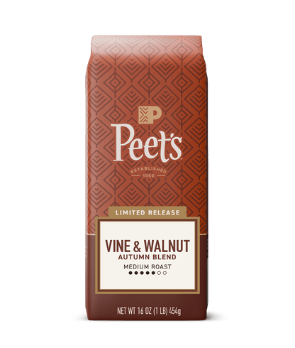 Peet's Vine & Walnut Autumn Blend coffee bag in a limited release medium roast, 16 oz. The packaging features a terracotta patterned background with a cream and brown label at the bottom, set against a solid dark green background.